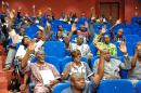 Members of Burkina Faso's interim parliament raise their hands on July 16, 2015 in Ouagadougou as they vote on a resolution asking the High Court to put deposed leader Blaise Compaore on trial for "high treason" and violating the constitution