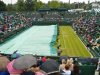 Ground staff pull on the protective rain covers on No 2 Court  at the All England Tennis Club in Wimbledon, London