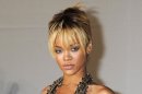 FILE - In this Feb. 21, 2012 file photo, performer Rihanna arrives for the Brit Awards 2012 at the O2 Arena in London. Rihanna says her collaboration with former boyfriend Chris Brown made sense. Brown appears on a remix to her song 