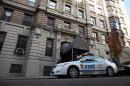 A police car sits in front of the Manhattan apartment building where the would-be terrorist Jose Pimentel lived with his mother on November 21, 2011 in New York City