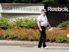 Guard walks outside world headquarters of Reebok in Canton, Massachusetts.