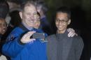 Grunsfeld, Associate Administrator for Science Mission Directorate, poses with Ahmed Mohamed, Texas teenager who was arrested after bringing homemade clock to school, during White House Astronomy Night in Washington