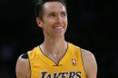 Lakers Steve Nash smiles as he plays in the Lakers season opening game against Dallas