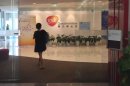 A Chinese employee walks into a GSK office in Beijing