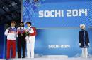 Men's 1,500-meter short track speedskating medalists, from left, Russia's Viktor Ahn, bronze, Canada's Charles Hamelin, gold, and China's Han Tianyu, silver, pose with their medals at the 2014 Winter Olympics in Sochi, Russia, Monday, Feb. 10, 2014. (AP Photo/Morry Gash)