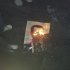 Demonstrators burn a photograph of Syria's President Bashar al-Assad during a protest at Yabroud