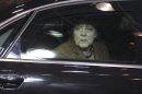 German Chancellor Angela Merkel looks out of her car window as she arrives for an EU summit in Brussels on Thursday, Nov. 22, 2012. EU leaders begin what is expected to be a marathon summit on the budget for the years 2014-2020. The meeting could last through Saturday and break up with no result and lots of finger-pointing. (AP Photo/Yves Logghe)