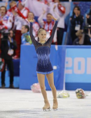 Russia holds lead in team event, Lipnitskaia soars