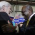 Republican presidential candidate, former House Speaker Newt Gingrich greets former candidate, Herman Cain during campaign stop, Monday, Jan. 30, 2012, in Tampa, Fla. (AP Photo/Matt Rourke)