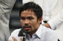 FILE - In this May 2, 2015 photo, Manny Pacquiao answers questions during a press conference following his welterweight title fight against Floyd Mayweather Jr. in Las Vegas. Pacquiao could face disciplinary action from Nevada boxing officials for failing to disclose a shoulder injury before the fight. Nevada Athletic Commission Chairman Francisco Aguilar said that the state attorney general's office will look at why Pacquiao checked 