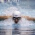 Michael Phelps competes in the 100-meter butterfly at the Indianapolis Grand Prix swimming meet in Indianapolis, Thursday, March 29, 2012. (AP Photo/Michael Conroy)