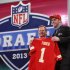 Eric Fisher, from Central Michigan, stands with NFL Commissioner Roger Goodell after being selected first overall by the Kansas City Chiefs in the first round of the NFL football draft, Thursday, April 25, 2013, at Radio City Music Hall in New York. (AP Photo/Jason DeCrow)