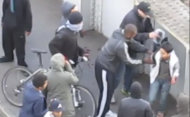In this image from amateur video, a gang of youths in Barking, East London stand around Malaysian accountancy student Mohammed Asyraf Haziq, 20, who had been attacked and mugged in the street by an earlier group during rioting Monday Aug. 8 2011. As one of this group appeared to help Haziq to his feet others took the opportunity to open his backpack and remove other valuables. The video of the attack on Haziq went viral Tuesday Aug 11 and has become one of the most memorable scenes from four days of unrest. So shocking was the robbing of an injured man that Prime Minister David Cameron felt moved to describe it as a sign of a deeper societal malaise in Britain. (AP Photo/Abdul Hamid via Sky/ APTN) UK OUT TV OUT NO SALES