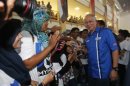 Malaysia's Prime Minister Najib Razak is greeted by youngsters after launching the "Voices of My Generation" youth programme in Kuala Lumpur