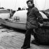 FILE - In this Jan. 3, 1969, file photo, John Fairfax stands beside his 22-foot rowing boat, Britannia, at King George V Dock in London, prior to sailing to the Canary Islands from where he planned to row across the Atlantic to Miami. Fairfax, the first known person to row alone across the Atlantic Ocean, has died at his Las Vegas-area home at the age of 74. His wife, Tiffany, says the adventurer died Feb. 8, 2012, of an apparent heart attack. Fairfax gained international attention in 1969 when he became the first person in recorded history to cross the Atlantic alone by rowboat. He dealt with sharks, storms and exhaustion on the six-month, 5,000-mile journey from the Canary Islands to Florida. (AP Photo/Peter Kemp, File)