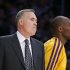 Los Angeles Lakers' Kobe Bryant, right, walks past head coach Mike D'Antoni in the second half of an NBA basketball game against the Brooklyn Nets in Los Angeles, Tuesday, Nov. 20, 2012. The Lakers won 95-90. (AP Photo/Jae C. Hong)