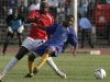 Swaziland's Tsabedze is tackled by Kenya's Oyombe during African Cup of Nations qualifier in Nairobi