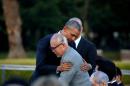 U.S. President Obama hugs atomic bomb survivor Shigeaki Mori as he visits Hiroshima Peace Memorial Park in Hiroshima, Japan
