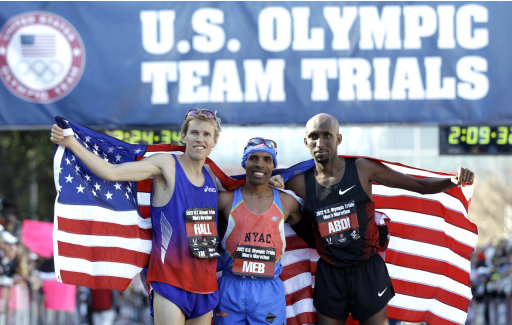 The top three men finishers, Ryan Hall, left, second, Meb Keflezighi, center, first, and Abdi Abdirahman, third, pose after the U.S. Olympic Trials Marathon, Saturday, Jan. 14, 2012, in Houston. (AP Photo/David J. Phillip)
