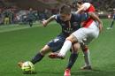PSG's Marco Verratti, left, challenges for the ball with Monaco's Bernardo Silva, during the French League One soccer match between Monaco and Paris Saint Germain, in Monaco stadium, Sunday, March 1, 2015. (AP Photo/Lionel Cironneau)