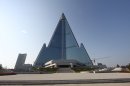 In this Sept. 23, 2012 photo released by Koryo Group on Wednesday, Sept. 26, 2012, the pyramid-shaped, 105-story Ryugyong Hotel stands in Pyongyang, North Korea. A foreign tour agency said the interior of the massive, hotel in the North Korea capital remains unfinished. Beijing-based Koryo Tours got a sneak peek inside the hotel that has been an off-limits construction site and remains a source of fascination for the outside world. (AP Photo/Koryo Group) NO SALES EDITORIAL USE ONLY