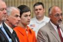 Christopher Plaskon, 17, third from left, appears in Superior Court in Milford, Conn., on Wednesday, June 4, 2014. Plaskon, charged with stabbing a classmate to death in school on their prom day, pleaded not guilty to murder Wednesday as his attorney said he was investigating a possible mental health defense. From left, are attorney Edward Gavin, Plaskon's uncle and guardian Paul Healy, Plaskon and attorney Richard Meehan Jr. (AP Photo/New Haven Register, Arnold Gold, Pool)