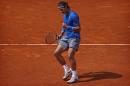 Rafael Nadal from Spain celebrates a point during a Madrid Open tennis tournament match against Jarkko Nieminen, from Finland, in Madrid, Spain, Thursday, May 8, 2014 . (AP Photo/Daniel Ochoa de Olza)