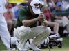 Louis Oosthuizen, of South Africa, reacts after missing a putt during a sudden death playoff on the 10th hole at the Masters golf tournament Sunday, April 8, 2012, in Augusta, Ga. (AP Photo/David J. Phillip)