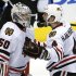 Blackhawks' Hjalmarsson celebrates with goalie Crawford after defeating the Kings in Game 4 of the NHL Western Conference final hockey playoff in Los Angeles