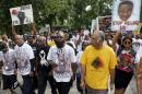 Michael Brown Sr. leads a memorial march for his son Michael in Ferguson
