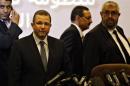 Egypt's PM Kandil is seen with Haddara, Minister of Petroleum at news conference in Cairo