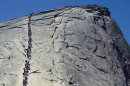 In this 2006 photo provided by the National Park Service, tourists climb Half Dome at Yosemite National Park, Calif. A climb up Half Dome was once only for the most seasoned outdoors people, but in recent years tourists and weekend warriors have been scaling the steep granite slope with the aid of steel cables. When daily traffic on the route reached 1,200 in 2009 and hikers routinely backed up like cars at rush hour, park officials realized something had to be done. (AP photo/National Park Service)
