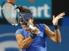 Li Na of China hits a return to Keys of the U.S. during their women's singles match at the Sydney International tennis tournament