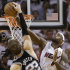 Miami Heat small forward LeBron James (6) blocks a shot by San Antonio Spurs center Tiago Splitter (22) of Brazil, during the second half of Game 2 of the NBA Finals basketball game, Sunday, June 9, 2013 in Miami. The Miami Heat won 103-84. (AP Photo/Lynne Sladky)