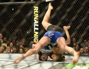 Cat Zingano took Ronda Rousey down right off the bat, but the champ quickly turned the tables. (USAT)