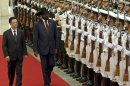 South Sudan's President Salva Kiir, right, reviews honor guard with Chinese President Hu Jintao, left, during a welcoming ceremony at the Great Hall of the People in Beijing, China, Tuesday, April 24, 2012. (AP Photo/Alexander F. Yuan)