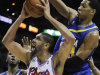 San Antonio Spurs' Tim Duncan (21) is defended by Indiana Pacers' Danny Granger, right, and Roy Hibbert during the second half of an NBA basketball game on Saturday, March 31, 2012, in San Antonio. (AP Photo/Darren Abate)