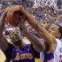 Los Angeles Clippers center Ryan Hollins, right, blocks the shot of Los Angeles Lakers center Dwight Howard during the first half of their NBA basketball game, Sunday, April 7, 2013, in Los Angeles. (AP Photo/Mark J. Terrill)