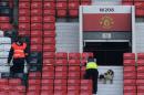 A sniffer dog searches the stands at Old Trafford on May 15, 2016