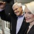 Republican presidential candidate, former House Speaker Newt Gingrich, is accompanied by his wife Callista during a campaign stop at the National Farm Toy Museum in Dyersville, Iowa, Tuesday, Dec. 27, 2011. (AP Photo/Charles Dharapak)