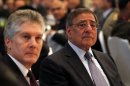 U.S. Defense Secretary Leon Panetta, right, and Australia's Defense Minister Stephen Smith, left, attend the opening session of the IISS Shangri-la Security Summit in Singapore on Friday June 1, 2012. (AP Photo/Wong Maye-E)