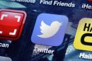 FILE - This Oct. 18, 2013, file photo shows a Twitter app on an iPhone screen in New York. Twitter Inc. said in a regulatory filing Thursday, Oct. 24, 2013, that it is putting forth 70 million shares in the initial public offering. (AP Photo/Richard Drew, File)