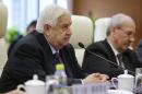Syrian Foreign Minister Walid al-Moualem speaks during a meeting with China's Foreign Minister Wang Yi in Beijing