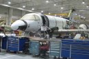 This Jan. 2011 photo shows Hawker Beechcraft employees in Wichita, Kansas working on the Hawker 4000 jet. The aircraft maker filed for bankruptcy protection Thursday, May 3, 2012 after reaching agreement with the majority of its secured lenders and bondholders to restructure its massive debt. (AP Photo/The Wichita Eagle/Kansas.com, Molly McMillin)