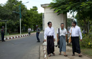 In this picture taken on Wednesday, Nov. 14, 2012, student leaders of a successive uprising, from left, Zaw Zaw Min, Hla Shwe, and Ragu Ne Myint walk outside the main gate of the University of Yangon, where President Barack Obama is scheduled to deliver a speech on Monday, Nov. 19, 2012, in Yangon, Myanmar. Since colonial times, the fight for change in Myanmar has begun on this leafy campus. It was a center of the struggle for independence against Britain and served as a launching point for pro-democracy protests in 1962, 1974, 1988 and 1996. For many, the school has today become a symbol of the country’s ruined education system and a monument to a half century of misrule. (AP Photo/Gemunu Amarasinghe)