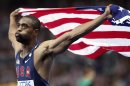FILE - In this Aug. 16, 2009 file photo, United States' Tyson Gay who placed second celebrates with the U.S. flag after the Men's 100m final during the World Athletics Championships in Berlin. Gay said Sunday, July 14, 2013 that he tested positive for a banned substance and that he will pull out of the world championships next month in Moscow. (AP Photo/Anja Niedringhaus, File)