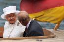 Britain's Queen Elizabeth II and her husband Prince Philip, The Duke of Edinburgh are seen during a boat trip on the River Spree in Berlin on June 24, 2015