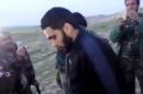 FILE - This image made from video posted on Twitter by a Kurdish fighter shows a man that the Kurdish military says is an American member of the Islamic State group shortly after he turned himself in to Kurdish fighters in northern Iraq, Monday, March 14, 2016. After months of losing ground in Iraq and Syria, the Islamic State group is showing signs of the wear and tear, with commanders on the ground saying they are seeing an increase in desertions. But the jihadis appear to be lashing back with more terrorist and chemical attacks. (Kurdish fighter via AP, File)