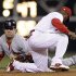 St. Louis Cardinals' Lance Berkman, left, steals second base past the tag from Philadelphia Phillies shortstop Jimmy Rollins during the second inning of a baseball game, Saturday, Sept. 17, 2011, in Philadelphia. (AP Photo/Matt Slocum)