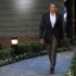 U.S. President Barack Obama walks to welcome guests at the G8 summit in Camp David